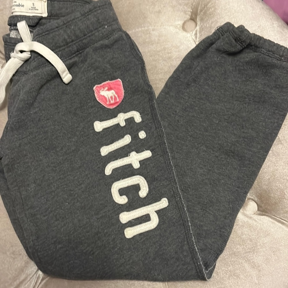 Abercrombie kids, gray sweatpants with Fitch logo down the leg